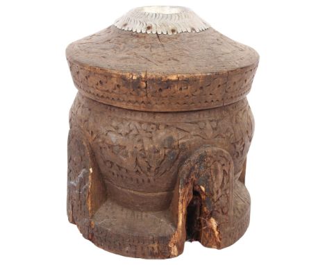 A large Tunisian carved hardwood coffee grinder, H31cm 