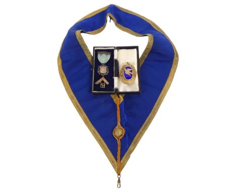 A silver-gilt blue enamel Masonic medallion for Northumberland with matching silk sash, a silver presentation fob to Brother 
