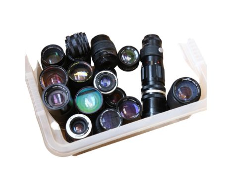 A large quantity of camera lenses, including such brands as Canon, Bell & Howell, Praktica Photax etc 