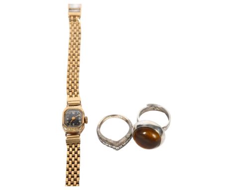 A lady's 9ct gold cased wristwatch with a 9ct gold woven strap, 17.3g gross, a silver and tigers eye set ring, and another (3