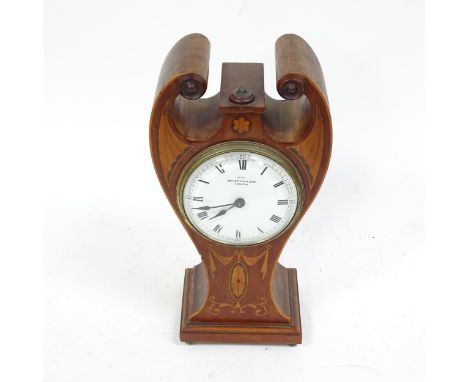 A mahogany inlaid mantle clock with Swan necked pendant, height 27cm.