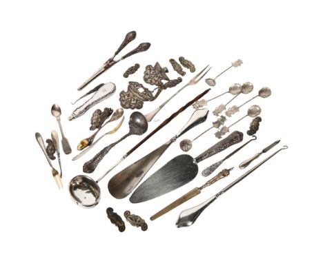 A silver and whale bone-handled toddy ladle, a silver-handled glove stretcher, a shoe horn, button hook etc 