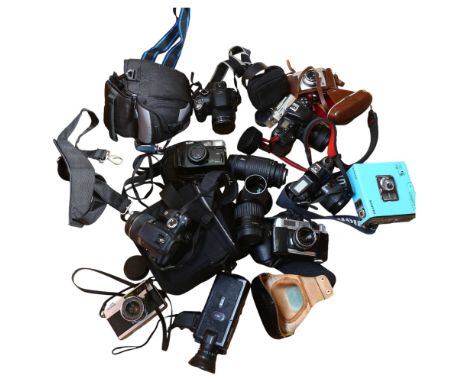 A box of various cameras and equipment, including a Canon EOS 350D, a Eumig Mini 5 camera, a Petri 7S camera, various camera 