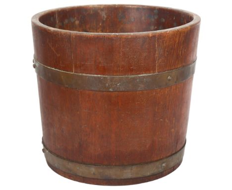 R A Lister & Company Ltd, a coopered oak planter, with label, diameter 31cm, height 27.5cm 