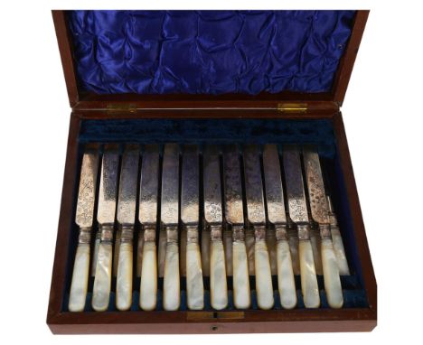 A silver plated fruit set with mother-of-pearl handles, for 12 people, in fitted mahogany case 