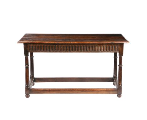 with a rectangular top above a thumb moulded frieze and turned ring knopped legs united by plain stretchers and ball feet, 13