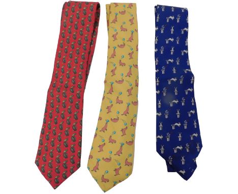 Three Hermes silk ties, comprising a red tie with pelicans, yellow tie with performing seals, and a dark blue tie with rabbit