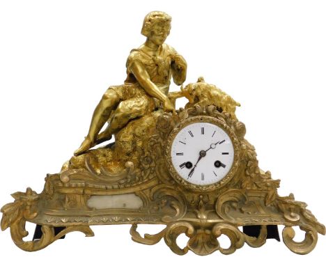 A late 19thC brass cased mantel clock, circular enamel dial bearing Roman numerals, eight day movement with bell strike, the 