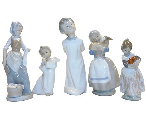 Two Lladro porcelain figures, modelled as a cherub playing a horn, and a girl holding a bowl of oranges, together with two Na