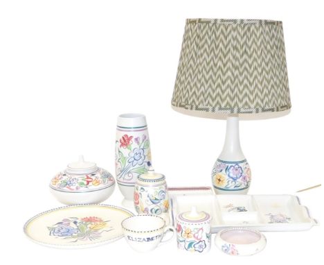 A group of Poole pottery, traditionally painted with flowers, including a four section hors d'oeuvre dish, vases, a table lam