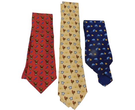 Three Hermes silk ties, comprising a red tie with performing elephants and mice, yellow tie with cockerel and alarm clocks, a