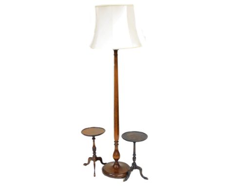 An early 20thC stained mahogany standard lamp, the hexagonal and turned column raised on a circular base, with shade, 194cm h