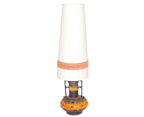 A mid century West German lava pottery floor standing lamp, with a conical shade, 125cm high. (AF)