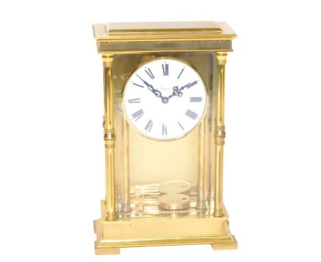 A Rapport brass cased mantel clock, circular white dial bearing Roman numerals, German clockwork movement with bell strike, t
