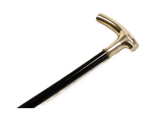 A late 19thC ebony walking stick, with a white metal handle, stamped 800, 85cm high. 