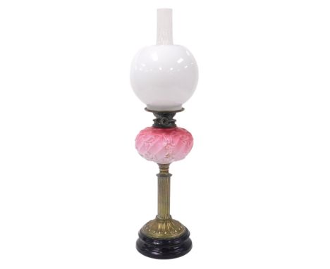 A late 19thC Hinks's duplex brass oil lamp, with a pink to white opaline glass reservoir, with moulded rococo scroll decorati