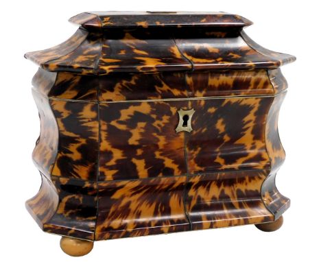 A Regency tortoiseshell tea caddy, of bombe form, the hinged lid with a monogrammed escutcheon, opening to reveal twin lidded