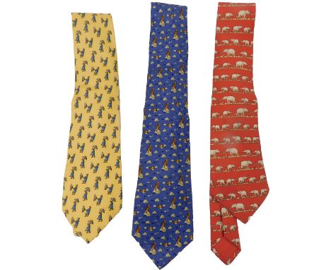 Three Hermes silk ties, comprising yellow tie with figures with umbrellas, blue tie with beavers, and red tie with elephants.