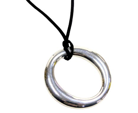 A Tiffany and Company silver O shaped pendant, on a rope string tie, impressed marks.