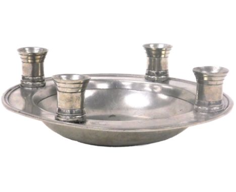 A Kenneth Turner pewter dish, with four candle holders to the rim, impressed mark, 31.5cm wide. 