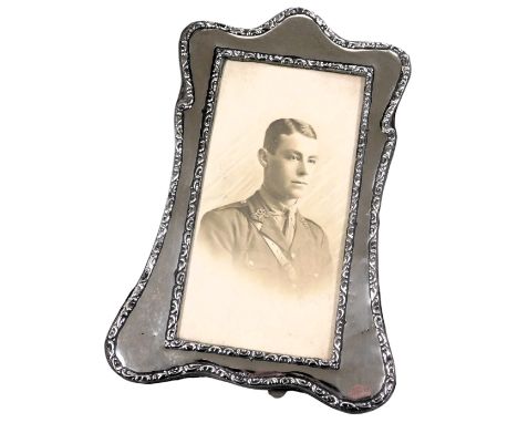 A silver backed strut photograph frame, with photographic portrait of an army officer, Chester, date mark worn, aperture 18cm