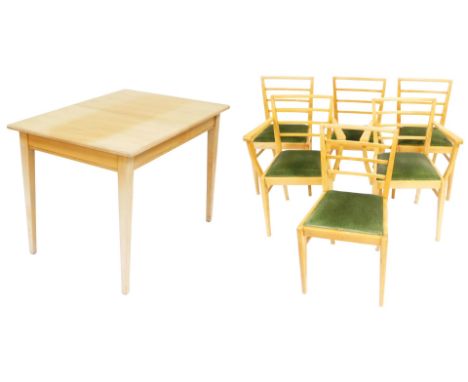 A mid century light oak draw leaf dining table, raised on tapering square legs, 77cm high, 153cm extended, 778cm deep, togeth