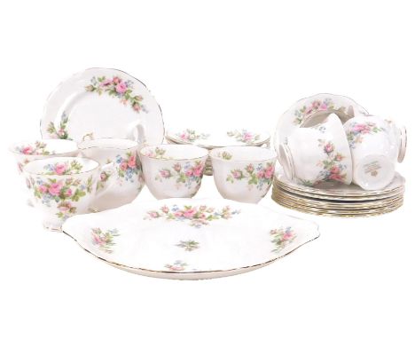 A Royal Albert porcelain Moss Rose pattern part tea service, comprising bread plate, cream jug, eight tea cups, nine saucers,