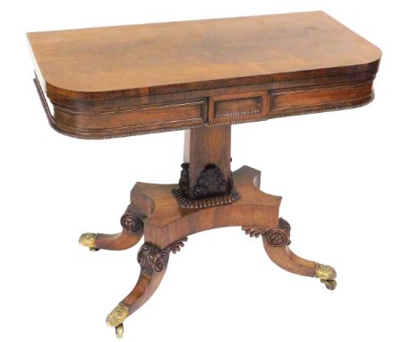 A Regency rosewood fold over card table, with a baize interior, raised on a canted rectangular column and quatrefoil base, ab