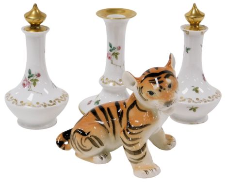 A Lomonosov pottery figure of a tiger cub, together with a Limoges porcelain dressing table set, painted with sprigs of flowe