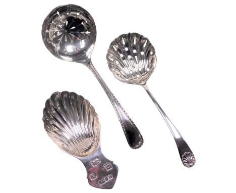 An Elizabeth II silver caddy spoon, of fluted form, Birmingham 1962, an Edward VII silver sugar sifting spoon, Sheffield 1902