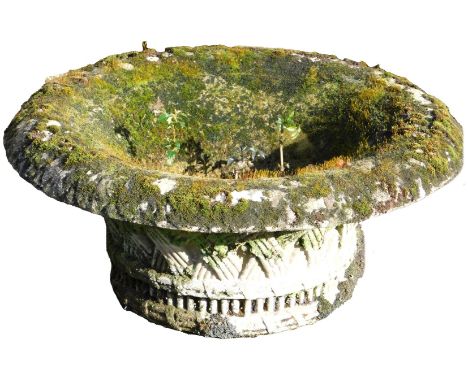 A stone garden planter of circular basket form, with an everted rim, 78cm wide. 