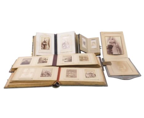 Five Victorian cloth bound photograph albums, containing portrait photographs and carte de visite.