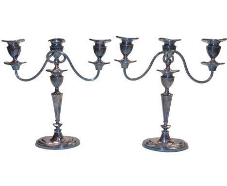 A pair of silver plated Adam style three branch candelabra, with detachable nozzles, 29cm high.