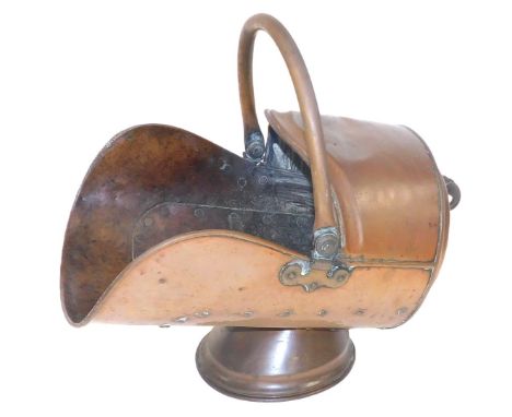 A Victorian copper helmet coal scuttle, 48cm wide.