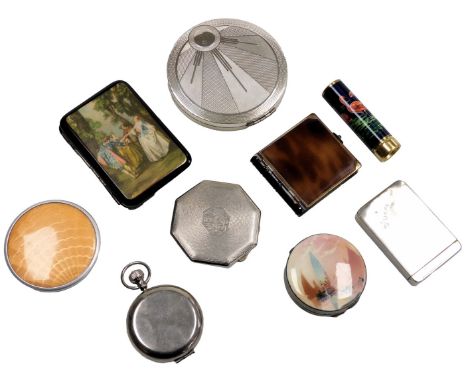 Six Stratton and other compacts, a cigarette case, jar lid, and a lipstick.