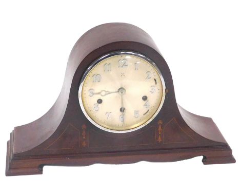 An early 20thC mahogany cased mantel clock, circular silvered dial bearing Arabic numerals, Hamburg American Clock Company ei