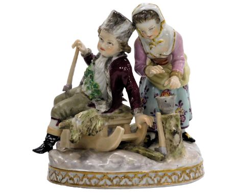 A Meissen Augustus Rex porcelain figure group, of a boy on a sled, and a girl warming her hands, raised on an oval base, pain