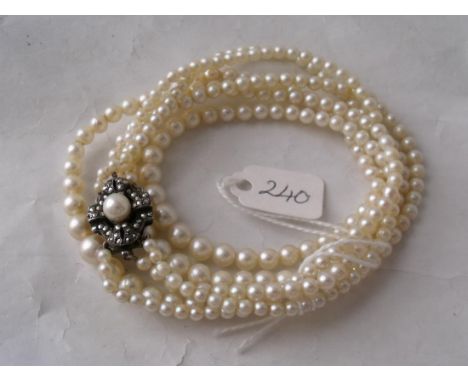A triple row of pearls with attractive pearl & marcasite    clasp         