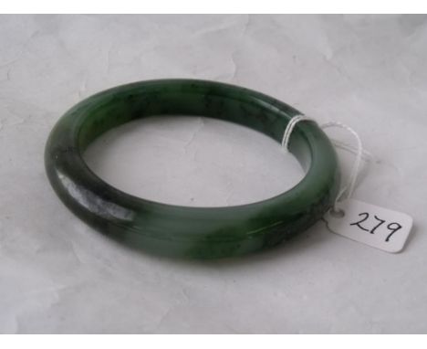 A jade bangle in moss green      