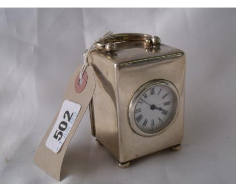 A small mantle clock with swing handle circular  enamelled dial 3.5” Lon 1903 by WC    