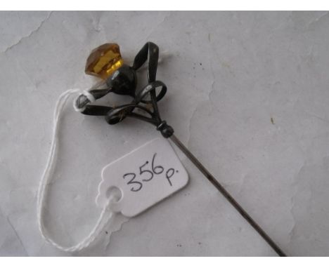 A long antique stick pin topped with a citrine & silver  thistle design mount 10” long     