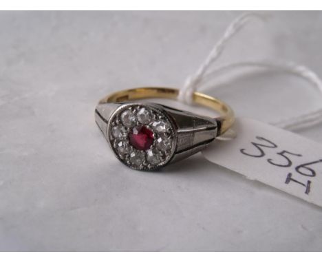 An unusual 18ct gold ruby & diamond flat cluster ring  with textured shoulders approx size 'M'    