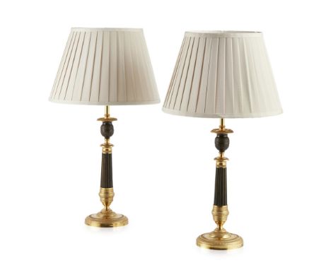 PAIR OF REGENCY GILT BRASS AND PATINATED METAL LAMPS  EARLY 19TH CENTURY   converted from candlesticks, with engine turned sc