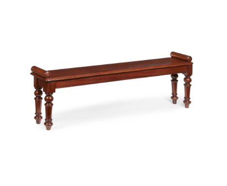 VICTORIAN MAHOGANY HALL BENCH  MID 19TH CENTURY   of large size, the ends with turned cylinder arms, raised on turned and tap