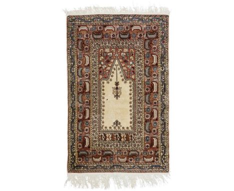 TURKISH SILK PRAYER RUG  LATE 20TH CENTURY   the cream mihrab with light brown spandrels, within light brown stylised foliate