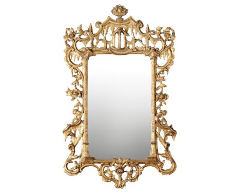 GEORGE III GILTWOOD MIRROR  18TH CENTURY   the rectangular mirror plate in a frame enclosed by C scrolls, dripping water, and