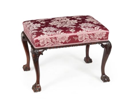 GEORGE II STYLE MAHOGANY STOOL  the rectangular padded seat in wine red damask upholstery, raised on carved cabriole legs end