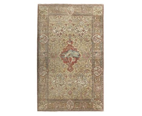 BENLIAN TABRIZ CARPET  NORTHWEST PERSIA, EARLY 20TH CENTURY   the light brown field with light red medallion depicting birds 