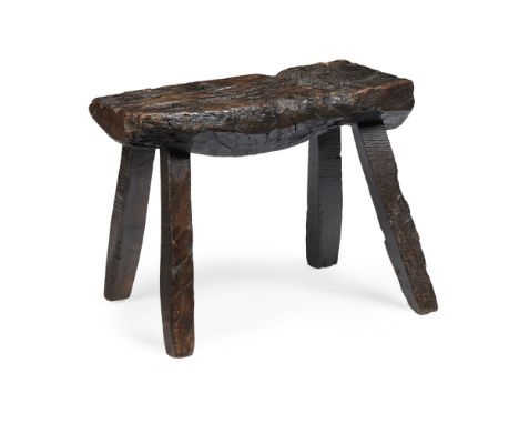 PRIMITIVE HARDWOOD BUTCHER'S BENCH  19TH CENTURY   the rough-hewn slab raised on square splayed legs  77cm long, 56cm high, 3
