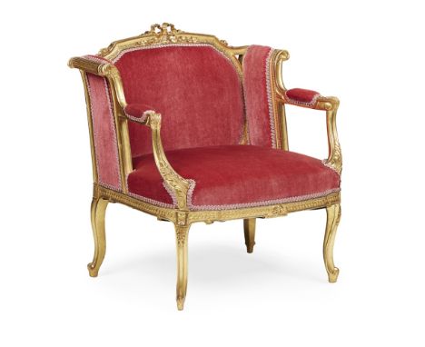 LOUIS XVI STYLE GILTWOOD ARMCHAIR  EARLY 20TH CENTURY   the low back with ribbon-tied cresting above a wide seat flanked by p